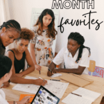 Women collaborate around a table. This image appears under text that reads: 30 Titles for Women's History Month #mooreenglish @moore-english.com