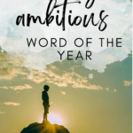 A person stands on a tall cliff. They are silhouetted against a blue sky and appear under text that reads: According to the Sorting Hat, "ambition" is a Slytherin characteristic. In Julius Caesar and Macbeth, ambition plays a part in our heroes' downfalls. After all, ambition is a necessary ingredient in pursuing your goals and holding high expectations for yourself. When I was brainstorming and trying to think of my annual word of the year, I cycled through countless options. However, when I think of 2024, I think of two major goals: to complete both of those goals, I need ambition.